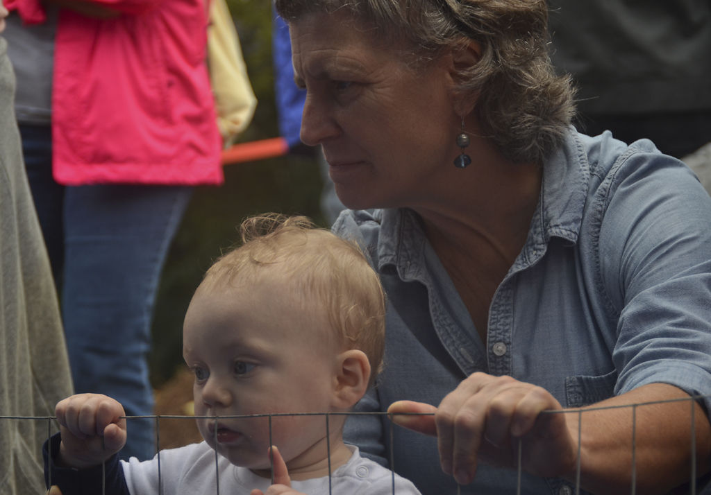 Vector Kauffman watches the "chicken drop" game with his grandma Catherine Doyle